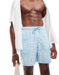 ASOS DESIGN swim shorts in mid length in blue geo print offre à 19,99€ sur ASOS